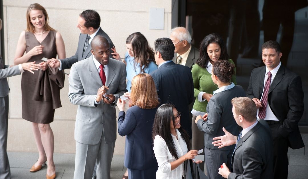 A photo of business professionals networking.
